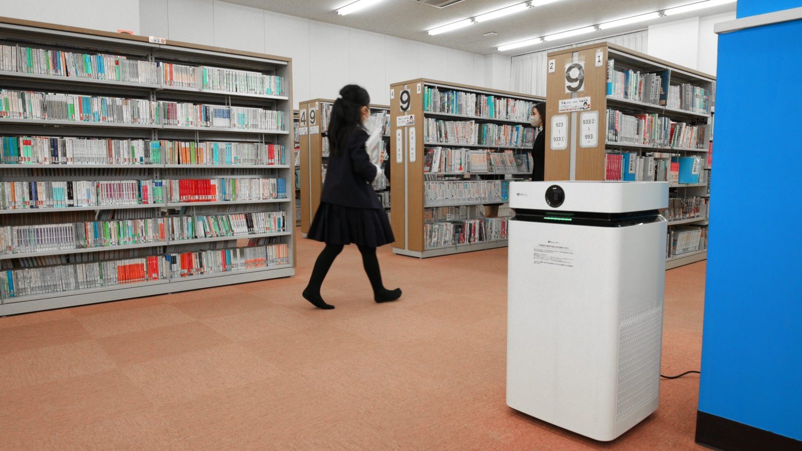 Airdog air purifier in a library with students